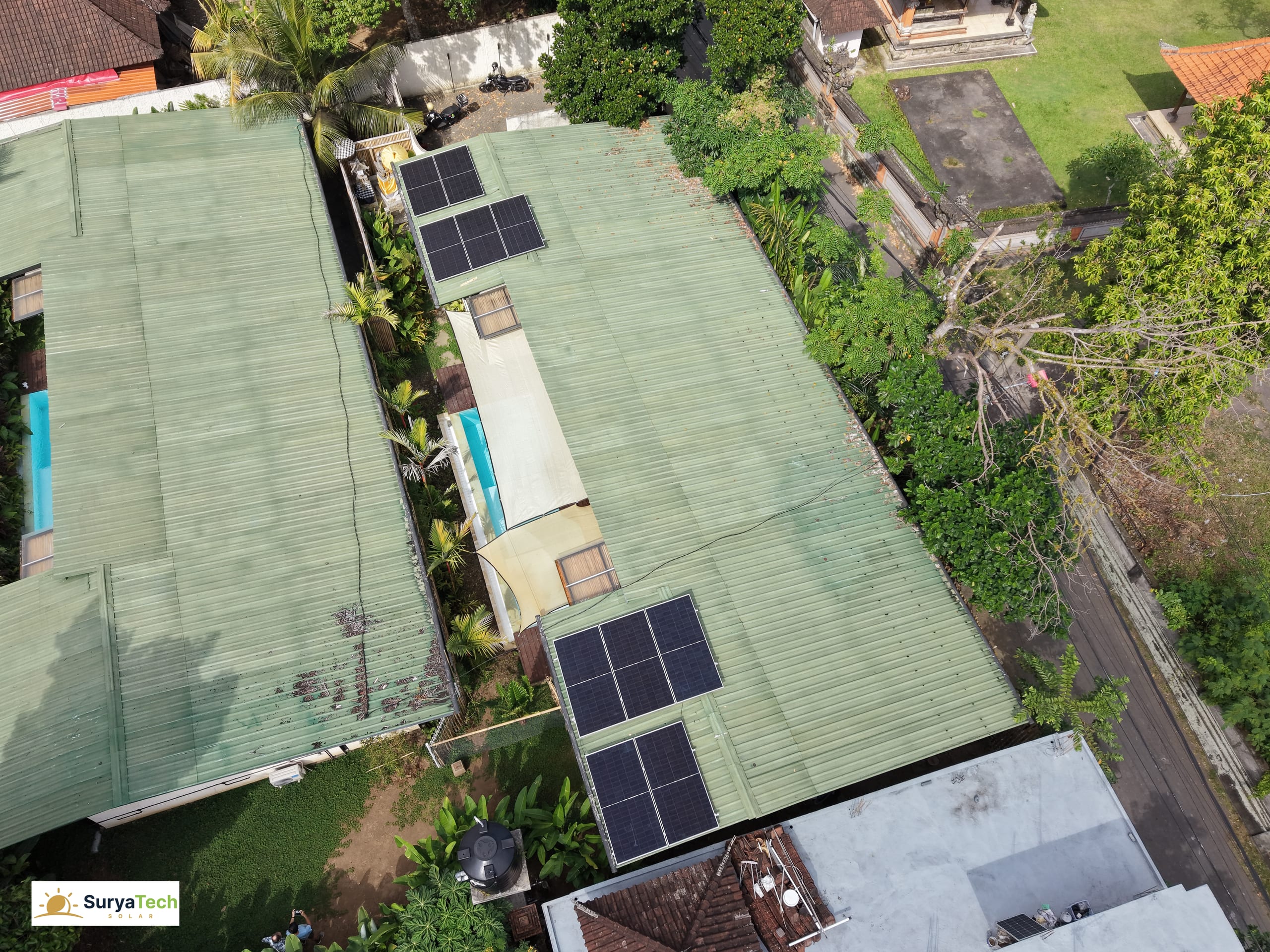 Ubud villa — aerial view of the rooftop solar array across both roof sections